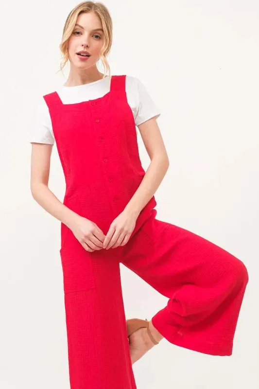 And The Why Gauze Loose Fit Tied Back Overalls sold by Charming Charlie