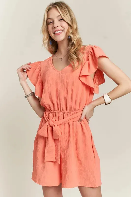 ADORA Ruffle Sleeves Romper with Pockets sold by Charming Charlie