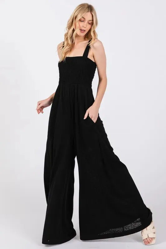 SAGE+FIG Smocked Flowy Wide Leg Jumpsuit sold by Charming Charlie