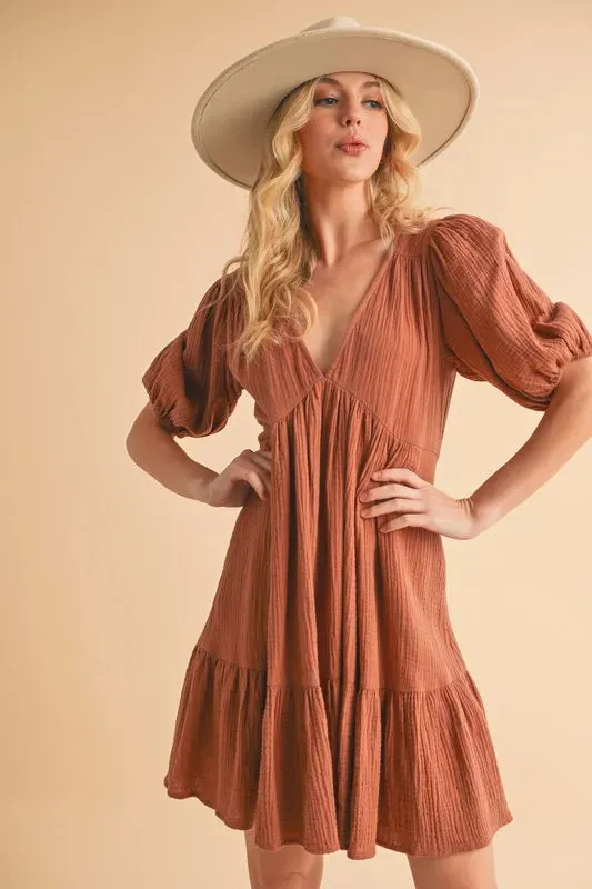 Aemi+Co Tied Back Ruffled Short Sleeve Mini Dress sold by Charming Charlie