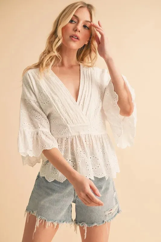 Aemi+Co Flounce Sleeve Eyelet Peplum Top sold by Charming Charlie