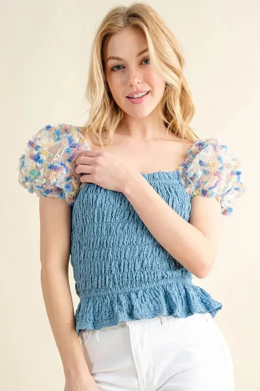 And The Why Embellishment Sleeve Smocked Top sold by Charming Charlie
