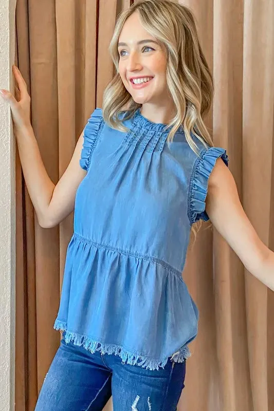 And The Why Chambray Ruffle Sleeveless Top sold by Charming Charlie