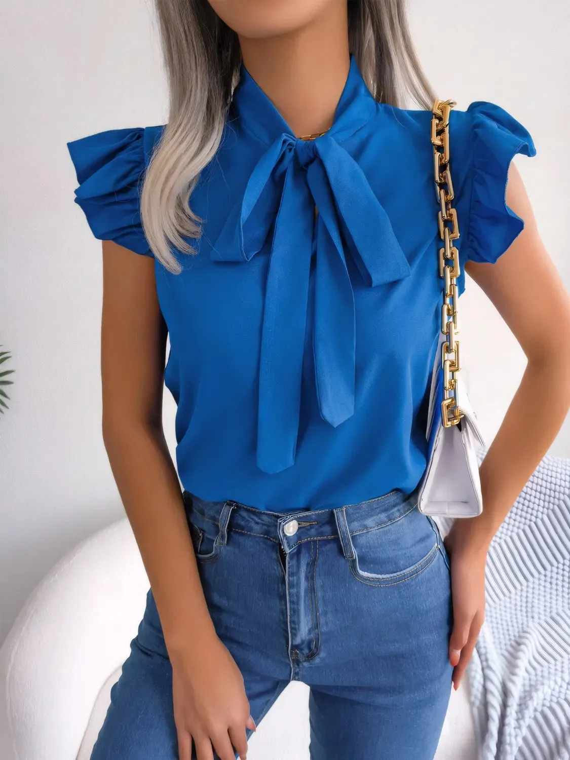 Ruffled Tie Neck Cap Sleeve Blouse sold by Charming Charlie product image thumbnail 3