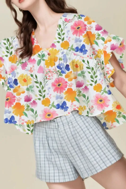 Floral Boxy Fit Ruffled Short Sleeve Blouse sold by Charming Charlie