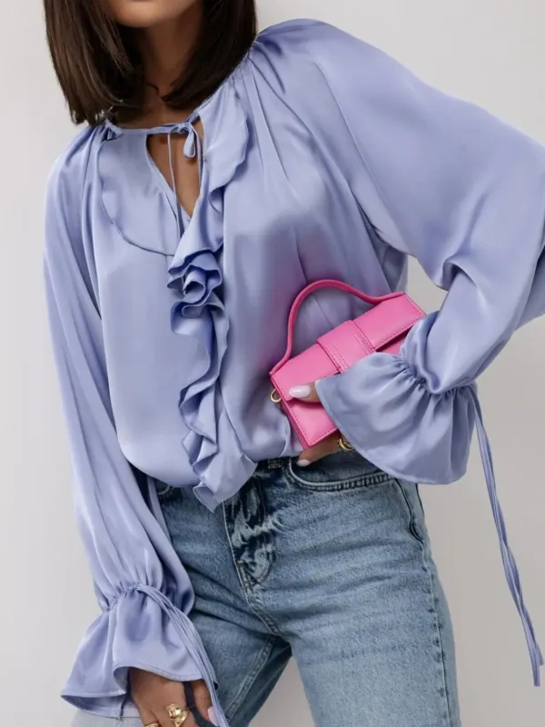 Ruffled Tie Neck Flounce Sleeve Blouse sold by Charming Charlie