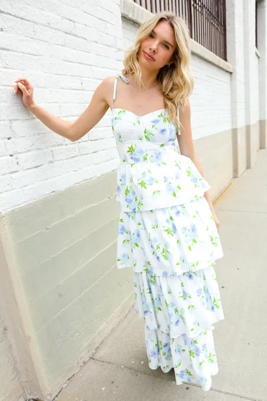 Stunning in Strap Bustier White & Blue Floral Tiered Chiffon Maxi Dress sold by Charming Charlie