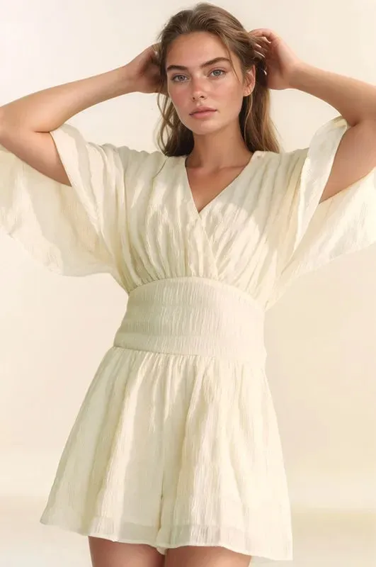 Davi & Dani Batwing Sleeve Waist Belt Romper sold by Charming Charlie