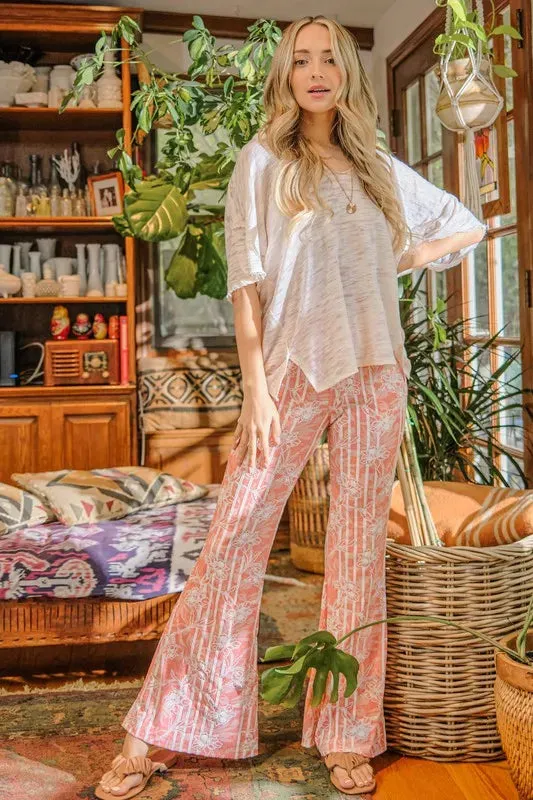 And The Why Wrinkle-Free Stretch Bell Bottom Flare Pants sold by Charming Charlie