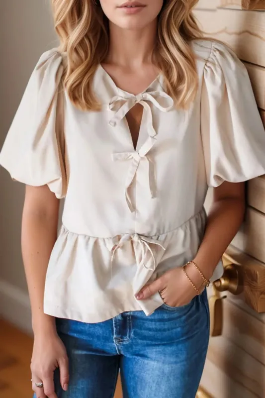 Bow Tie Short Puff Sleeve Ruffle Hem Blouse sold by Charming Charlie
