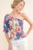 And The Why Allover Floral Print Smocked One Shoulder Blouse sold by Charming Charlie