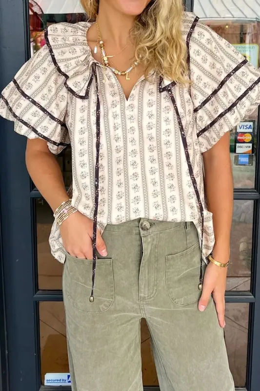 Floral Ruffled Collar Short Puff Sleeve Printed Blouse sold by Charming Charlie