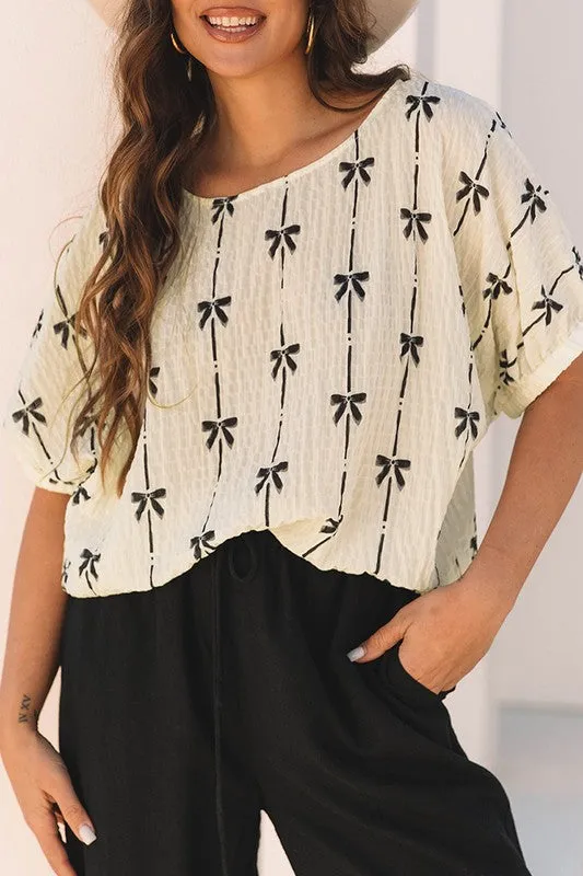 Bow Print Puff Short Sleeve Top sold by Charming Charlie