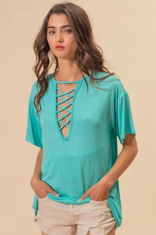 BiBi Jersey Knit Top with Criss Cross Front Neck Detail sold by Charming Charlie