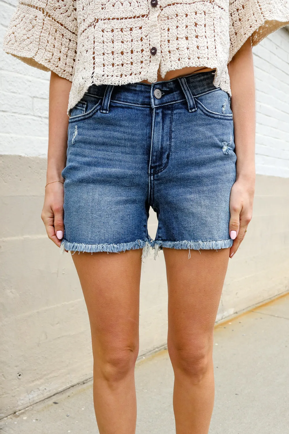 Judy Blue Medium Blue Mid Rise Fray Distressed Denim Shorts sold by Charming Charlie