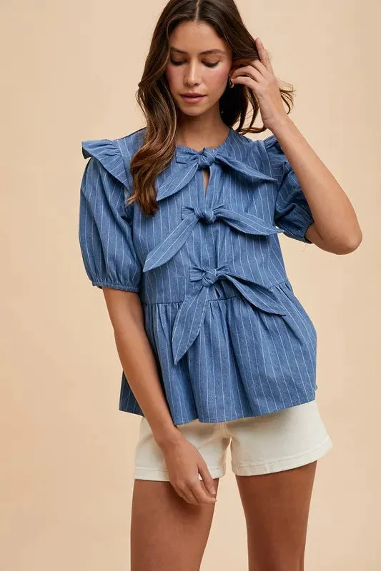 Annie Wear Stripe Front Bow Denim Peplum Blouse sold by Charming Charlie