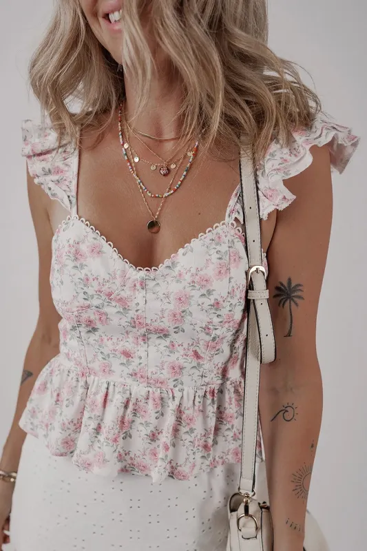 Floral Flutter Peplum Tank Top sold by Charming Charlie