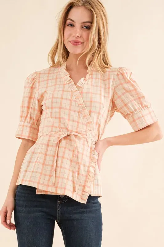 And The Why Plaid Patterned and Ruffled Wrap Blouse Top sold by Charming Charlie