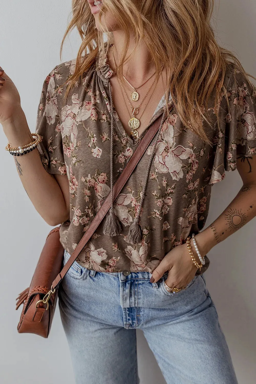 Floral Print Tassel Tie Split Neck Short Sleeve Blouse sold by Charming Charlie
