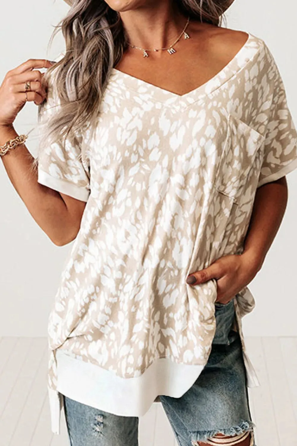 Leopard Print V Neck Side Slit Loose Fit T Shirt sold by Charming Charlie