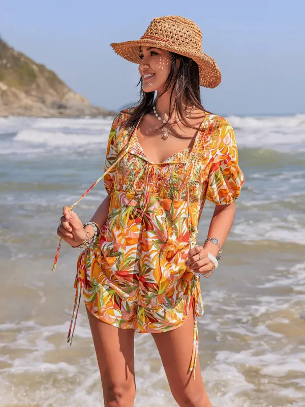 Smocked Printed Tie Neck Romper sold by Charming Charlie