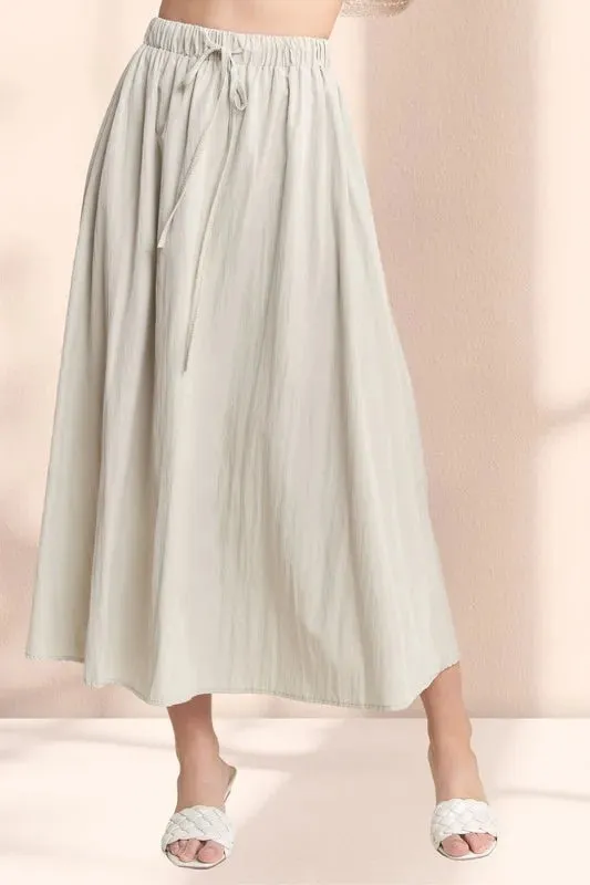 ADORA Drawstring Waist Crinkle Maxi Skirt sold by Charming Charlie