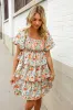 Find Love Floral Print Smocked Neck Puff Sleeve Ruffle Tiered Dress sold by Charming Charlie