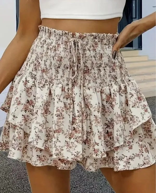 Floral smocked mini skirt sold by Charming Charlie