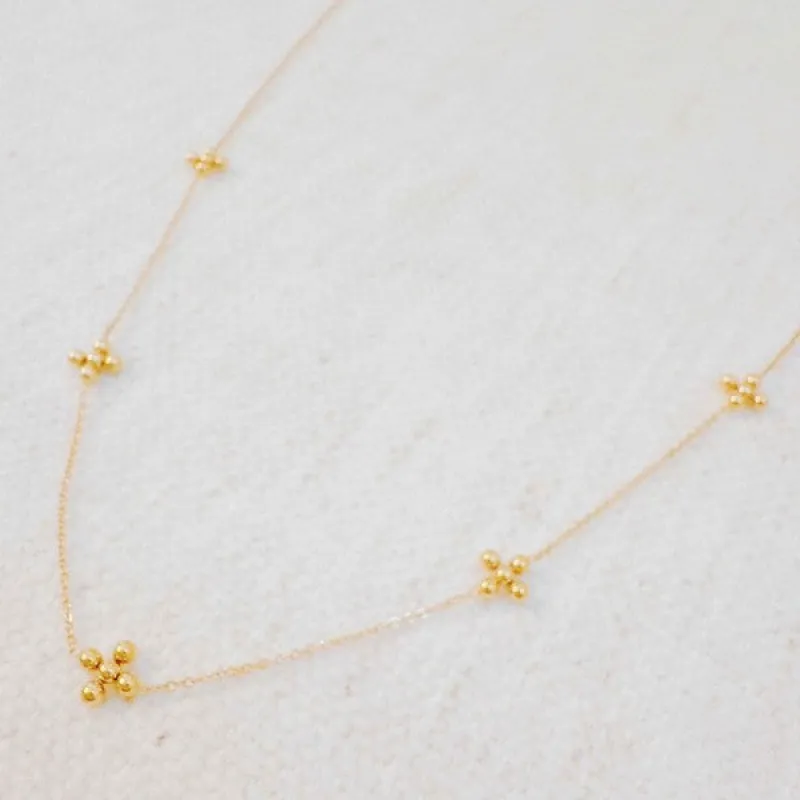 Dot Dot Golden Cross Necklace sold by Charming Charlie