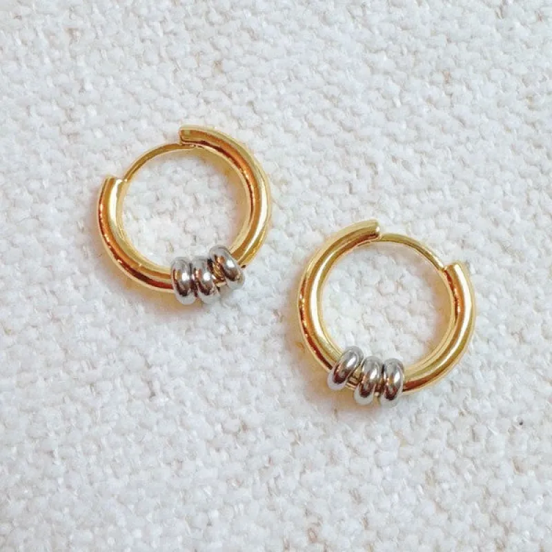 Ringed Up Two Toned Huggie Hoop Earrings sold by Charming Charlie
