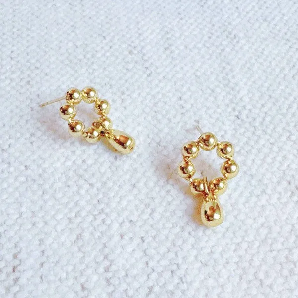 Golden Ball Petal Drop Earrings sold by Charming Charlie