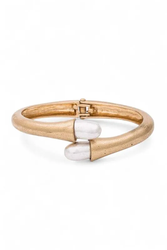 2 Tone Iconic Hinged Bangle sold by Charming Charlie