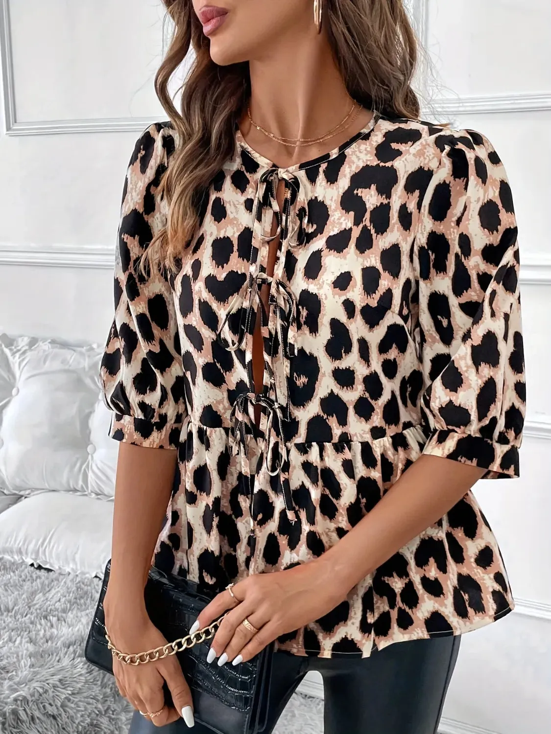 Tied Leopard Round Neck Half Sleeve Blouse sold by Charming Charlie product image thumbnail 4