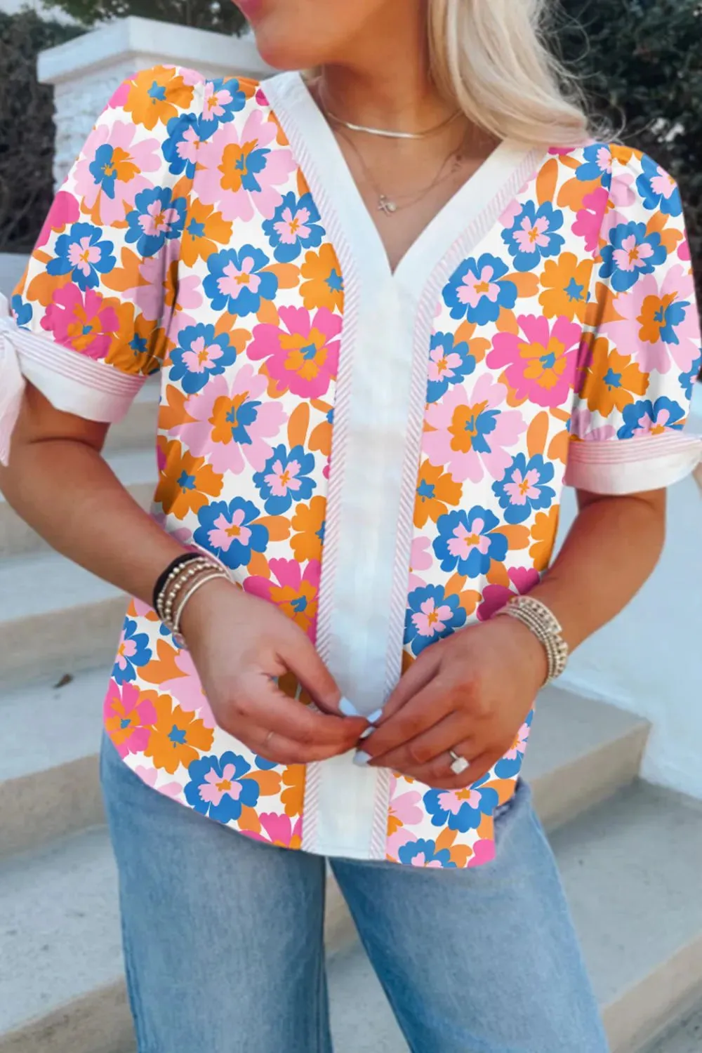 Floral Striped Edge V Neck Knotted Short Sleeve Blouse sold by Charming Charlie