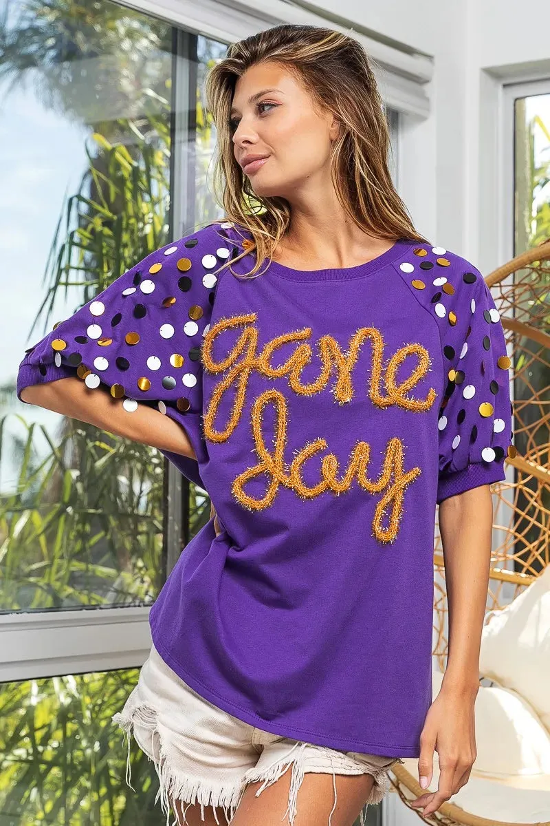 BiBi Game Day Metallic Letter Spangle Sleeve Top sold by Charming Charlie