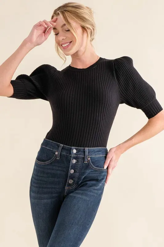 And The Why Puffed Half Sleeve Rib Basic Bodysuit sold by Charming Charlie