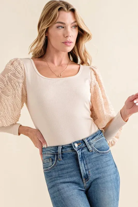 And The Why Textured Puff Sleeve Bodysuit sold by Charming Charlie