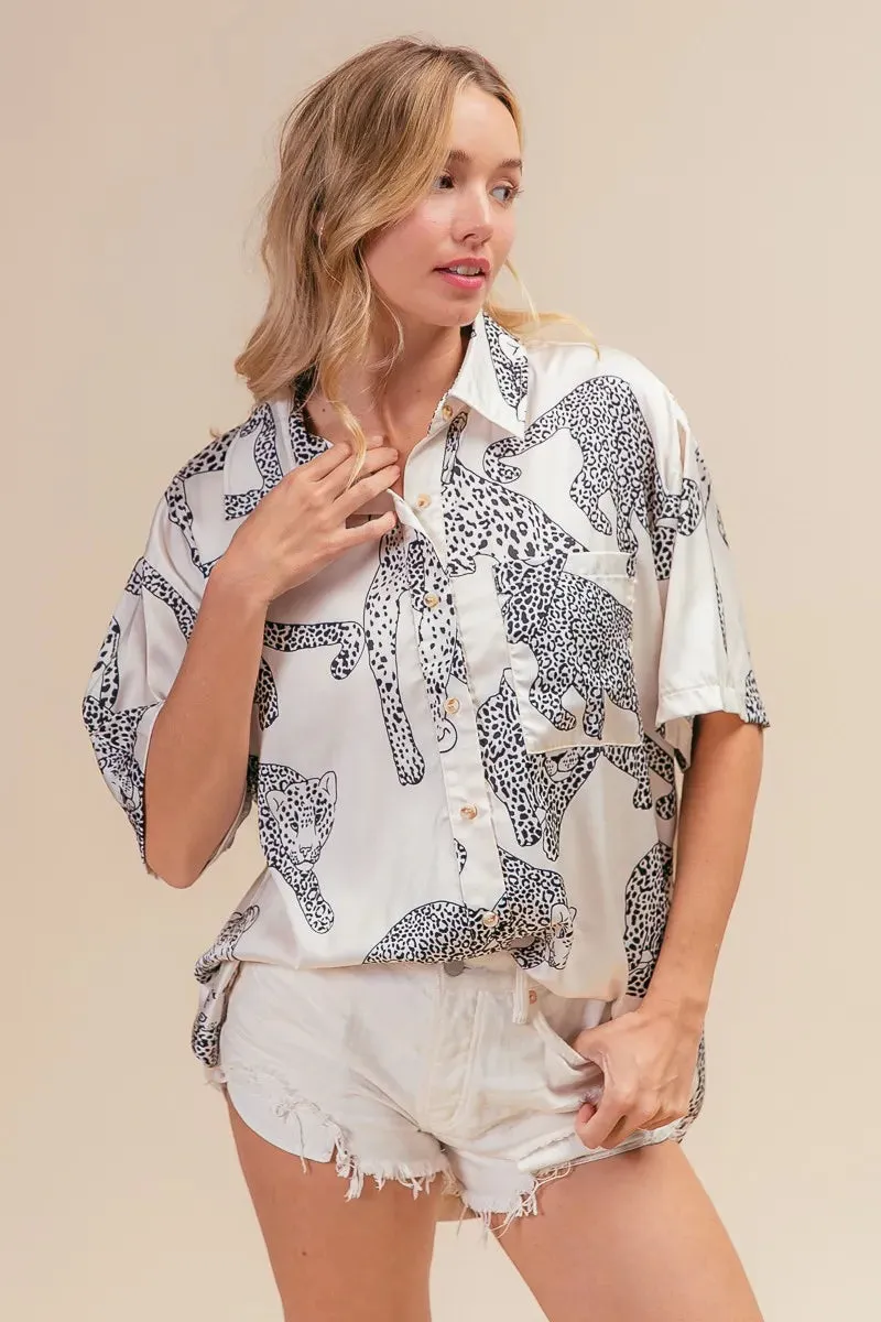 BiBi Leopard Print Short Sleeve Silky Satin Shirt Top sold by Charming Charlie