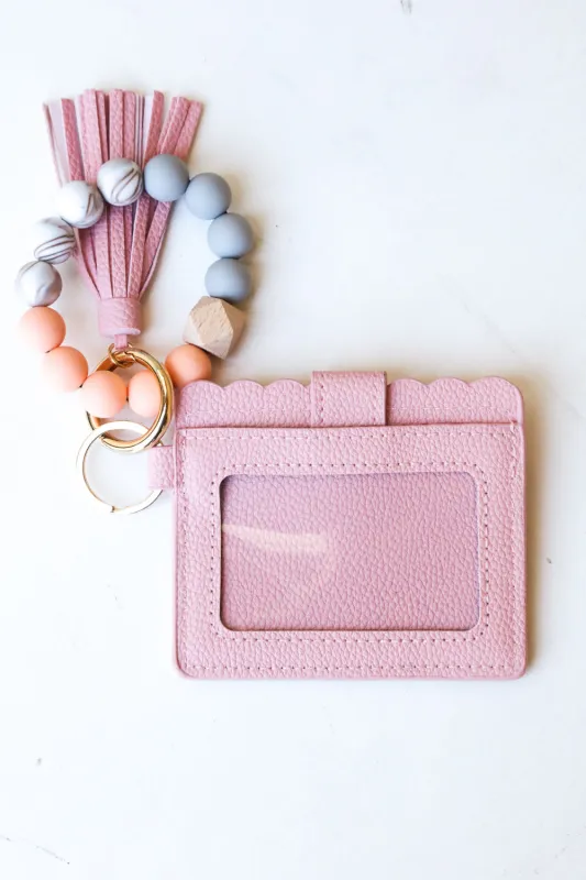 Blush Silicone Bead Slim Wallet Wristlet with Tassel sold by Charming Charlie