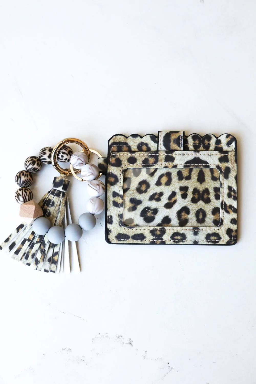Animal Print Silicone Bead Slim Wallet Wristlet with Tassel sold by Charming Charlie