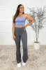 Motion Mastery Flared Yoga Pants in Titanium sold by Charming Charlie