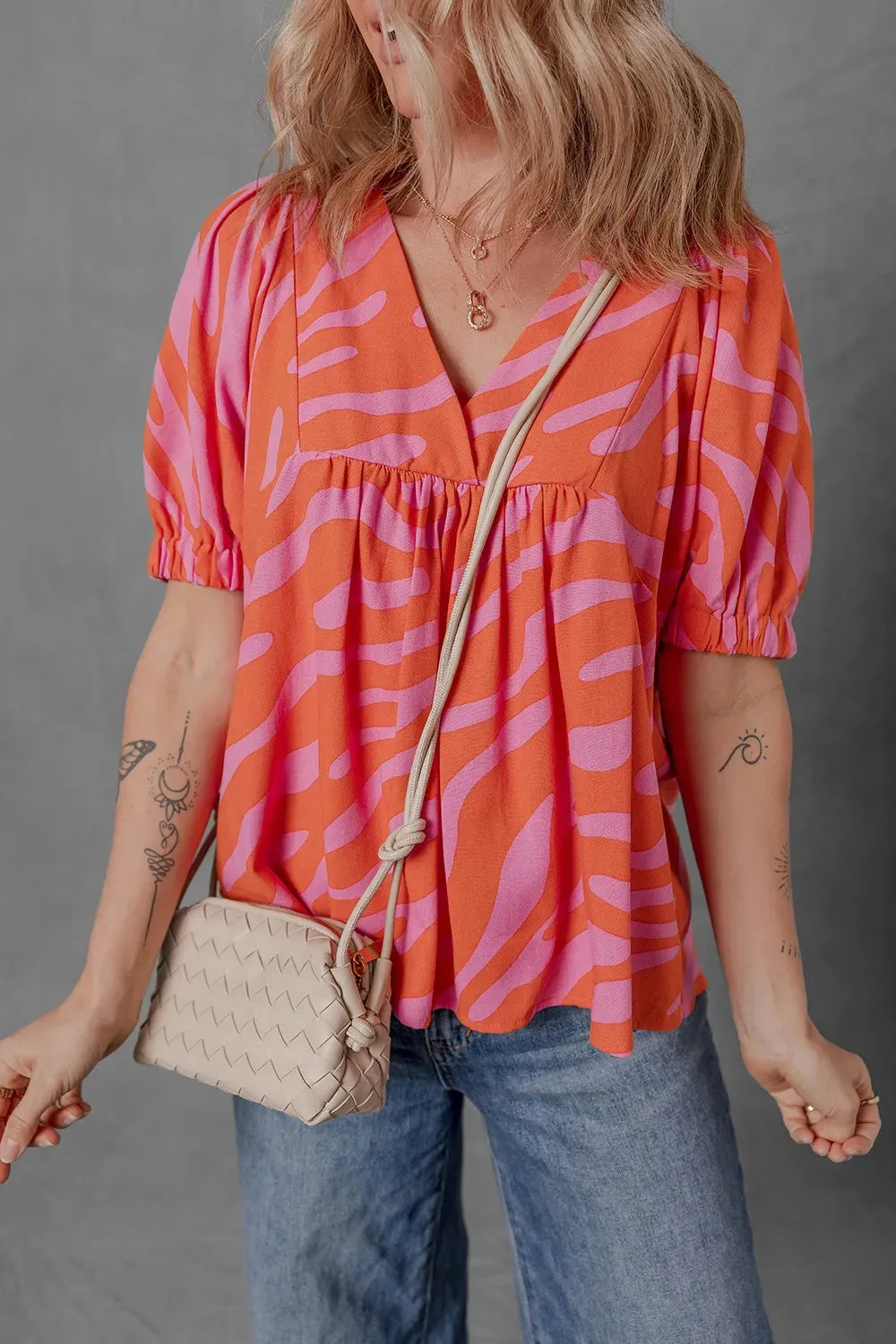 Zebra Stripe Print Ruched Cuff Half Sleeve V Neck Blouse sold by Charming Charlie