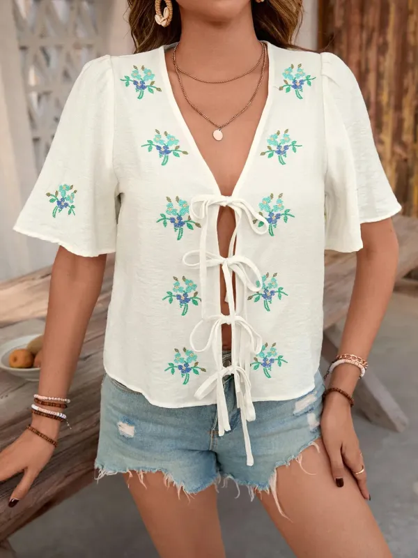 Embroidered V-Neck Short Sleeve Shirt sold by Charming Charlie