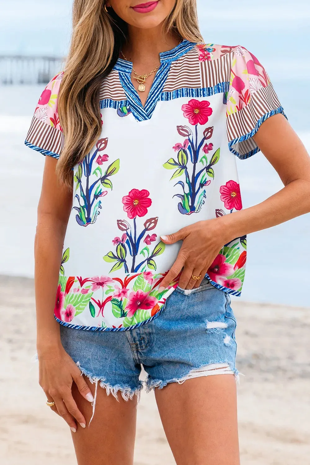 Floral Striped Patchwork Short Sleeve Split Neck Blouse sold by Charming Charlie