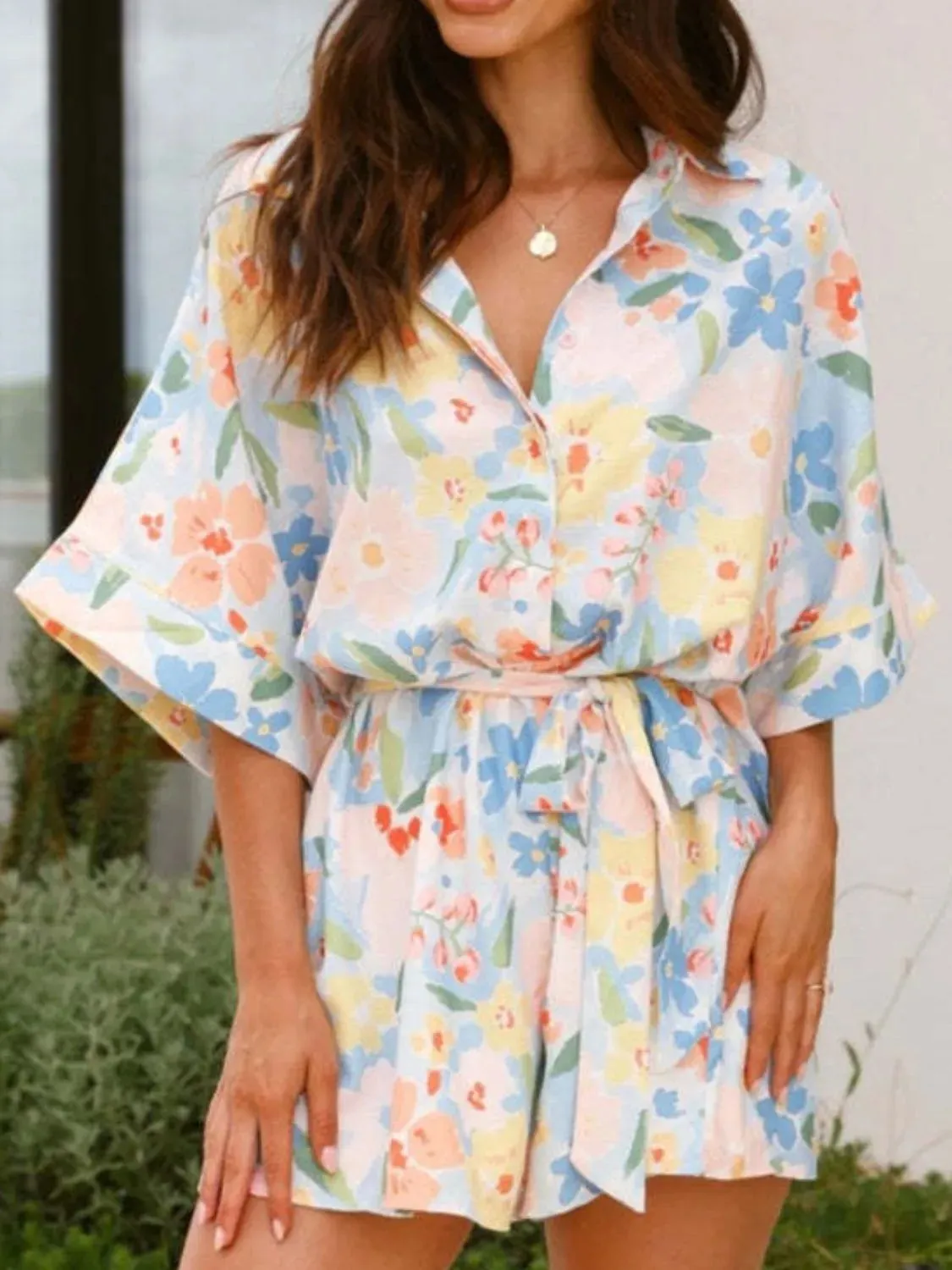Printed Half Sleeve Tie Waist Romper sold by Charming Charlie