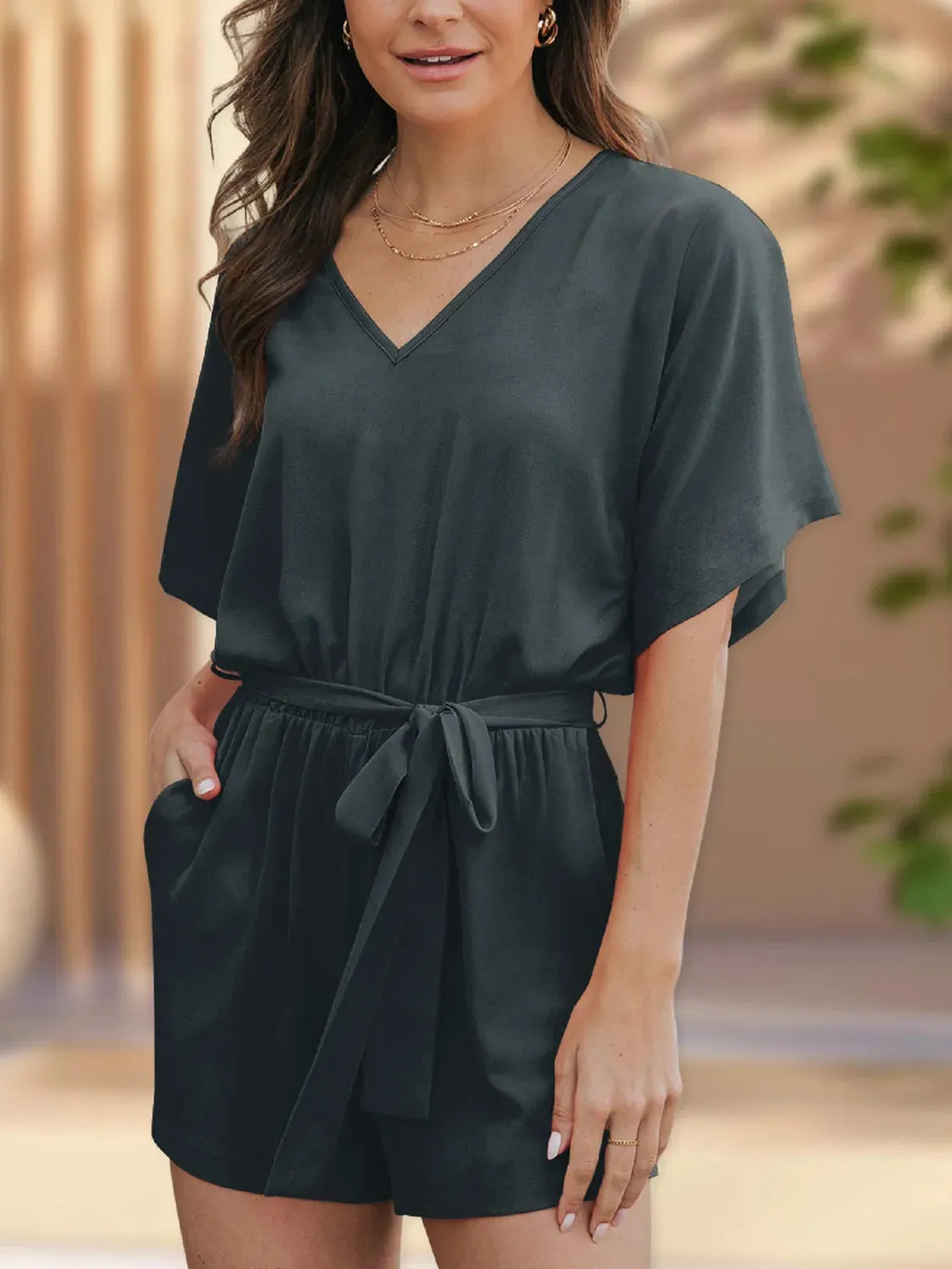 V-Neck Half Sleeve Tie Waist Romper sold by Charming Charlie