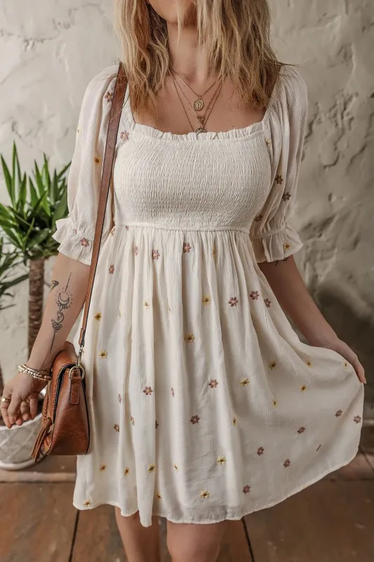 Embroidered Flower Smocked Bust Half Puff Sleeve Empire Waist Textured Flowy Dress sold by Charming Charlie