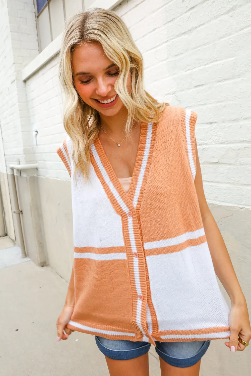 Put Together Orange V Neck Button Down Color Block Sweater Vest sold by Charming Charlie product image thumbnail 3