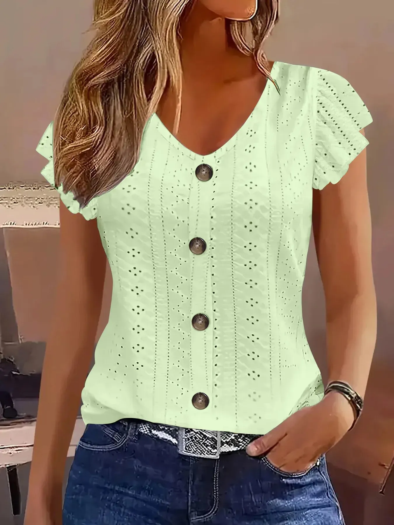 Eyelet Button-Front Flutter Sleeve Top sold by Charming Charlie
