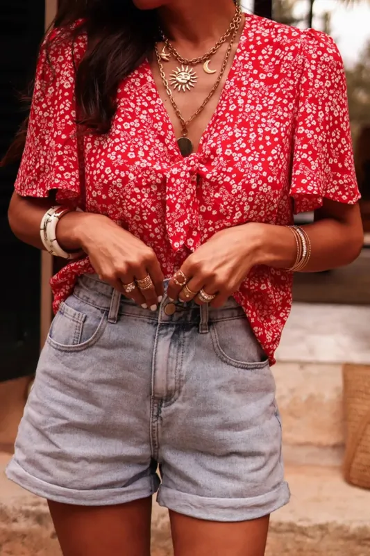 Boho Floral Printed Half Sleeve Knotted V Neck Blouse sold by Charming Charlie